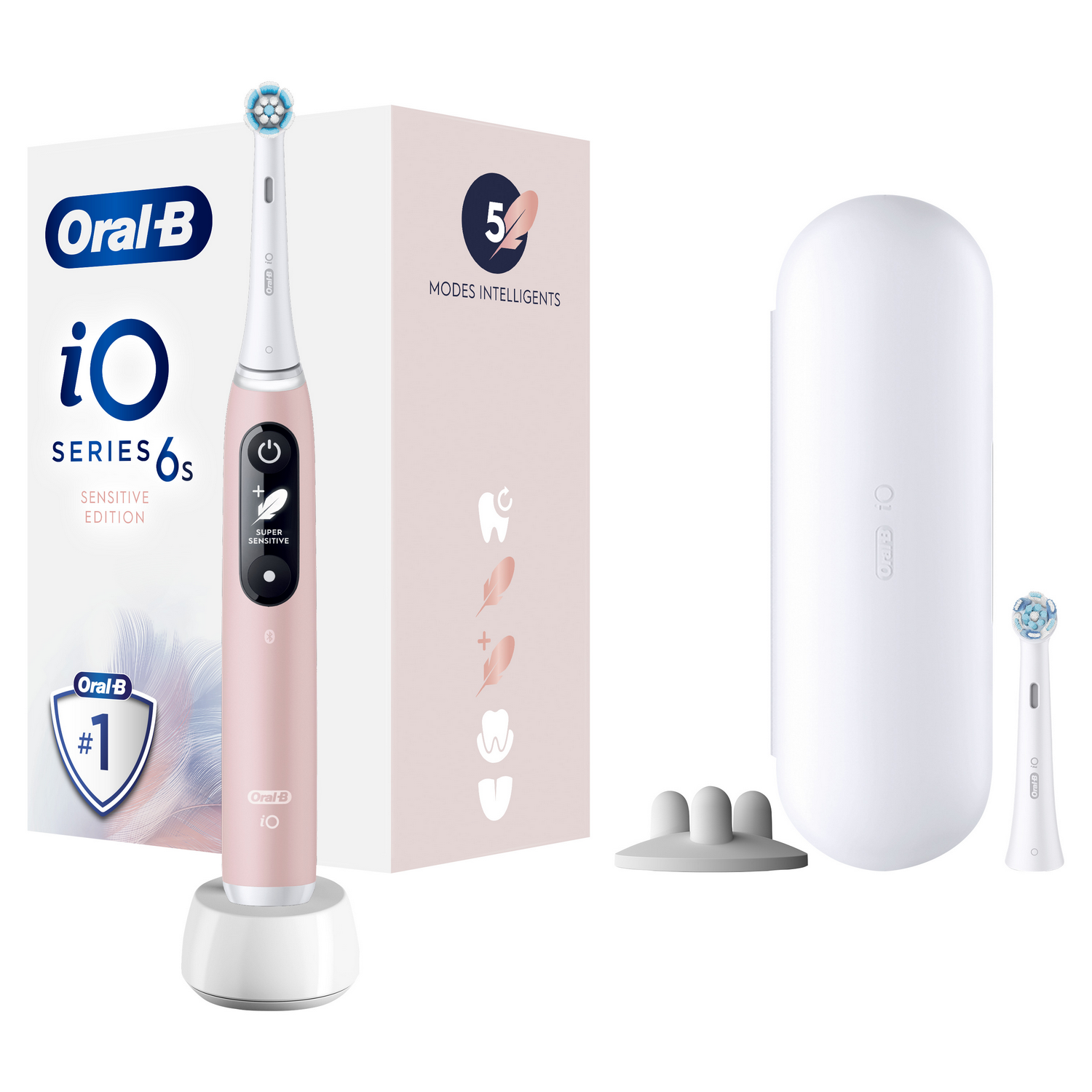 Pink Oral-B electric toothbrush, box, charger, and brush heads.