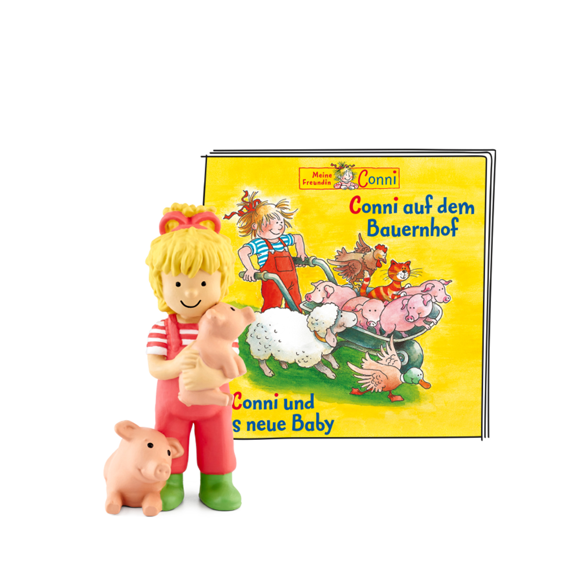 Conni-Spielfigur mit Schwein und Buchcover mit der Aufschrift 'Conni auf dem Bauernhof'.