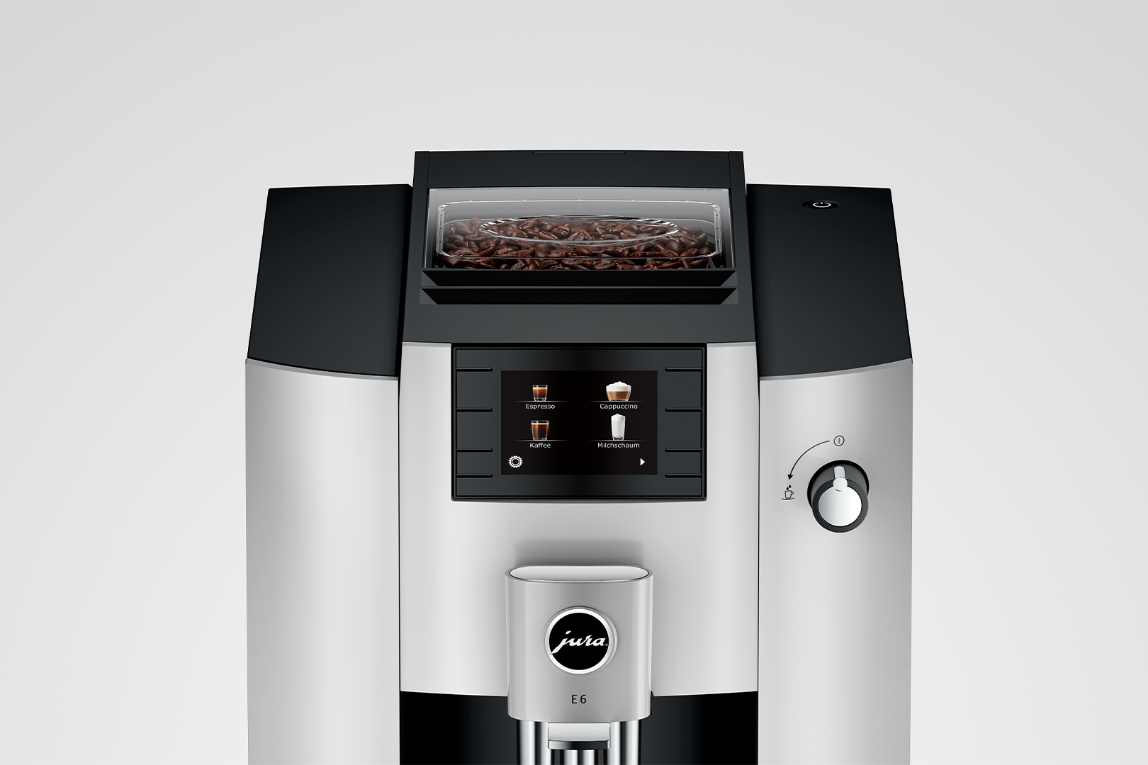 Primo piano di una macchina da caffè Jura E6 argento e nera con un contenitore per chicchi.