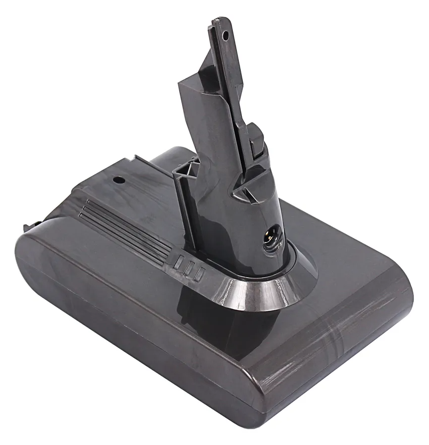 Chargeur de batterie gris foncé sur une surface blanche, vue en angle.