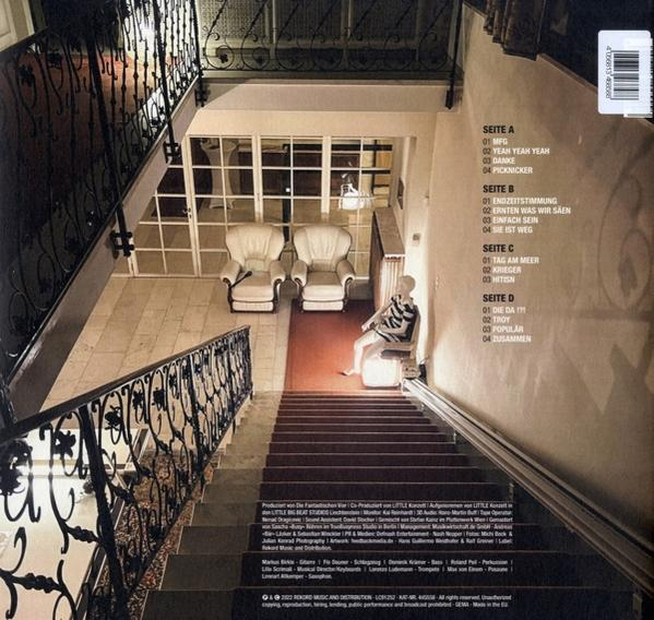 Vinyl-Schallplatte, Rückseite des Covers mit Text und Treppe.