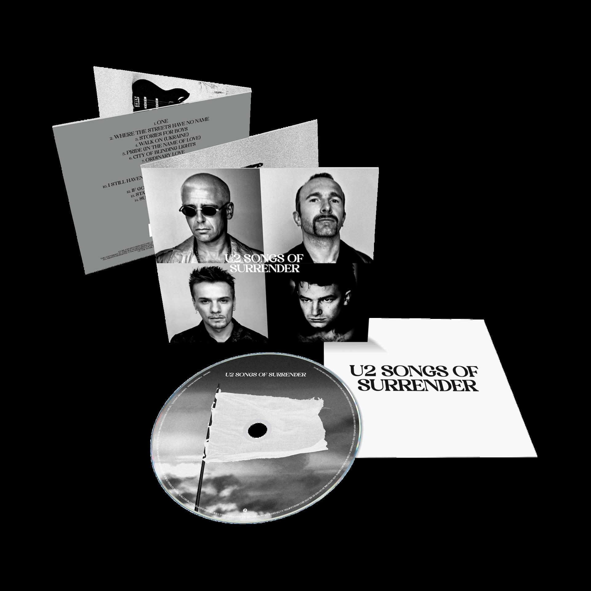 A U2 'Songs of Surrender' albuma a zenekar képeivel és egy CD-vel.