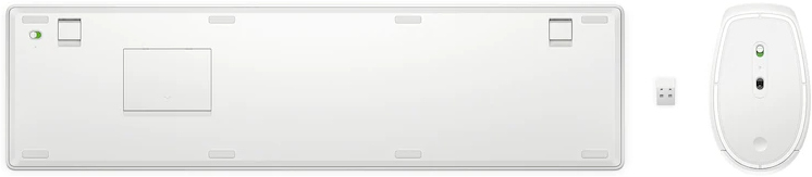 The bottom view of a white keyboard, mouse and USB receiver. There are some stickers on the keyboard.