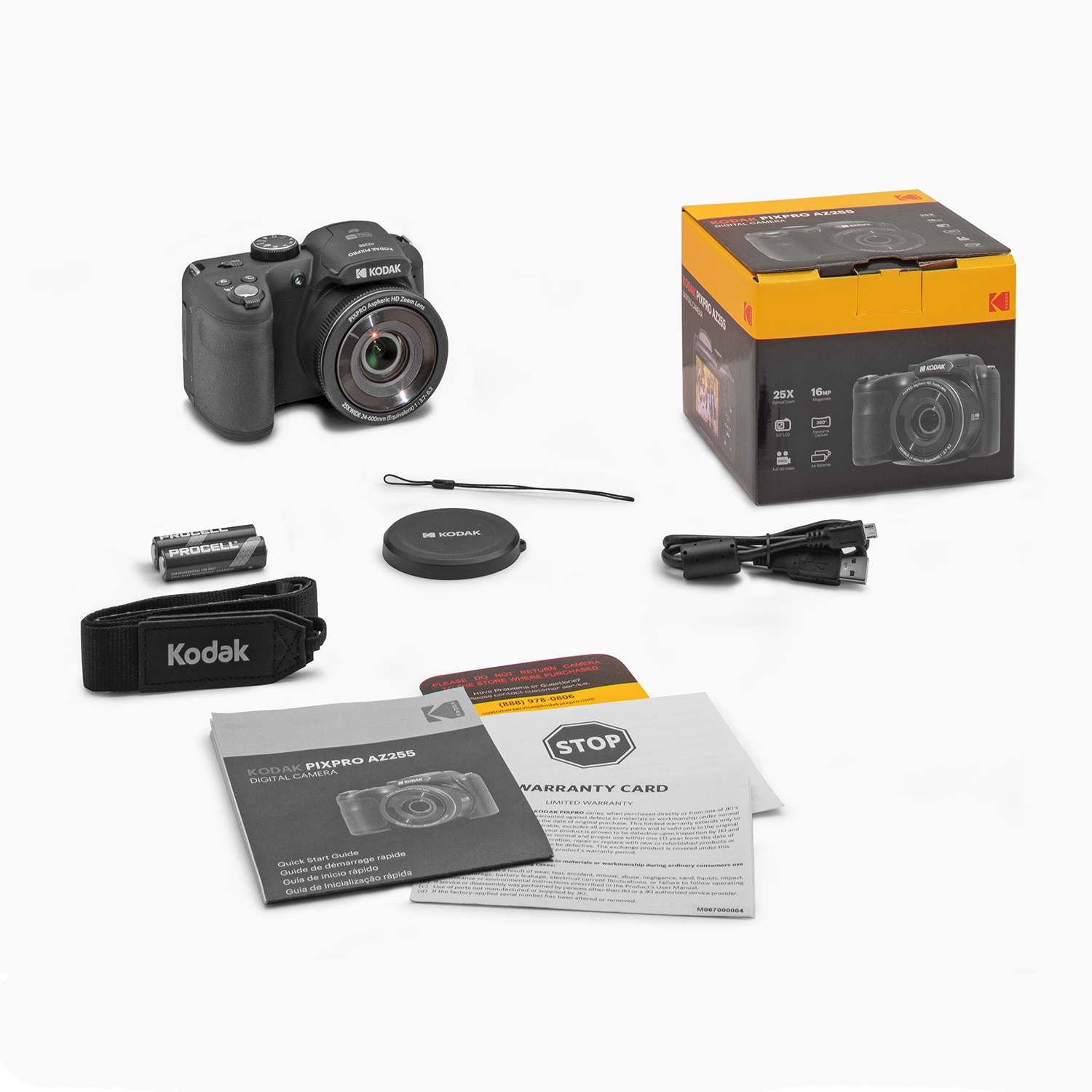 Fotocamera Kodak PixPro, accessori e scatola su una superficie bianca. Include batteria, cinturino, tappo e manuali.