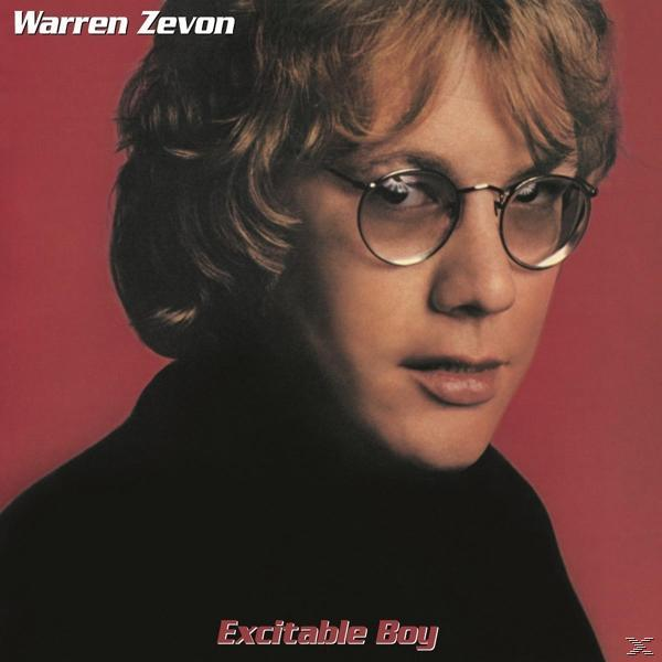 Warren Zevon album borítója. Szemüveget és fekete inget visel vörös háttér előtt.