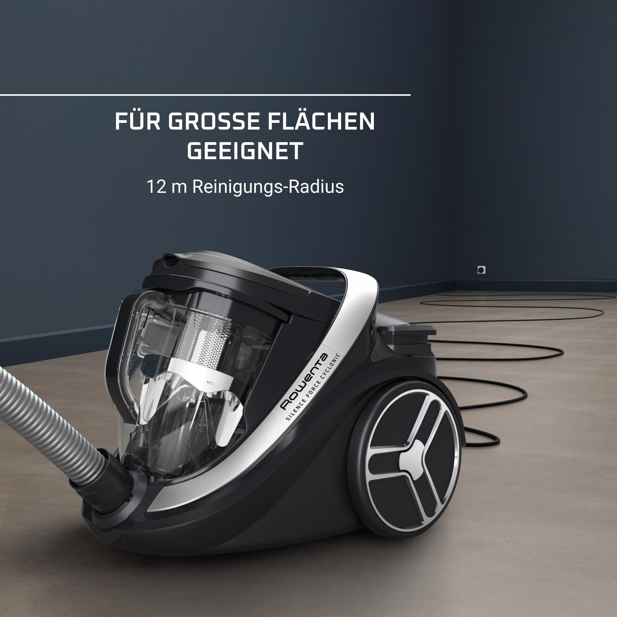 Ein schwarz-weißer Staubsauger auf einem Holzboden.