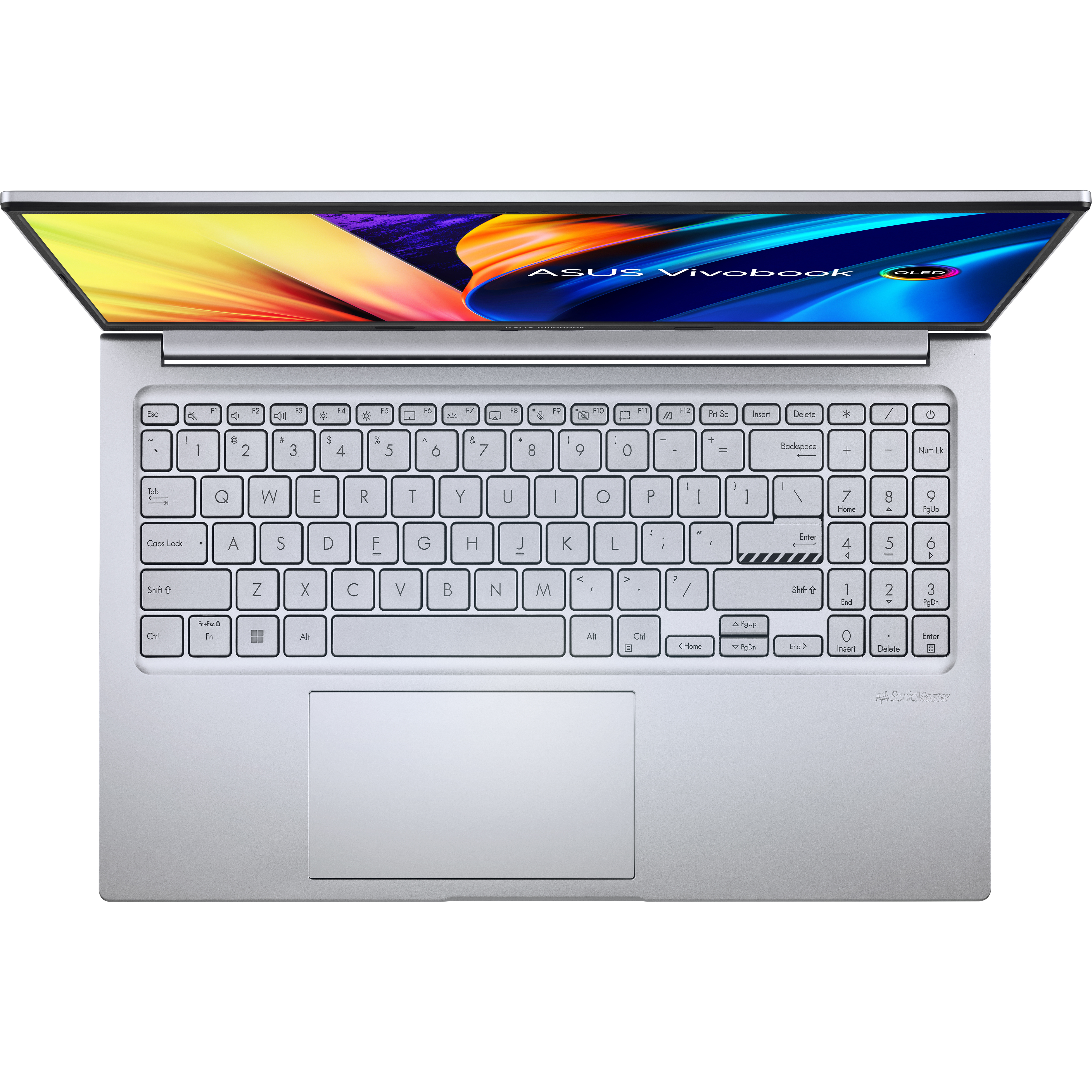 Se ve un teclado de computadora portátil desde arriba, con la pantalla abierta.