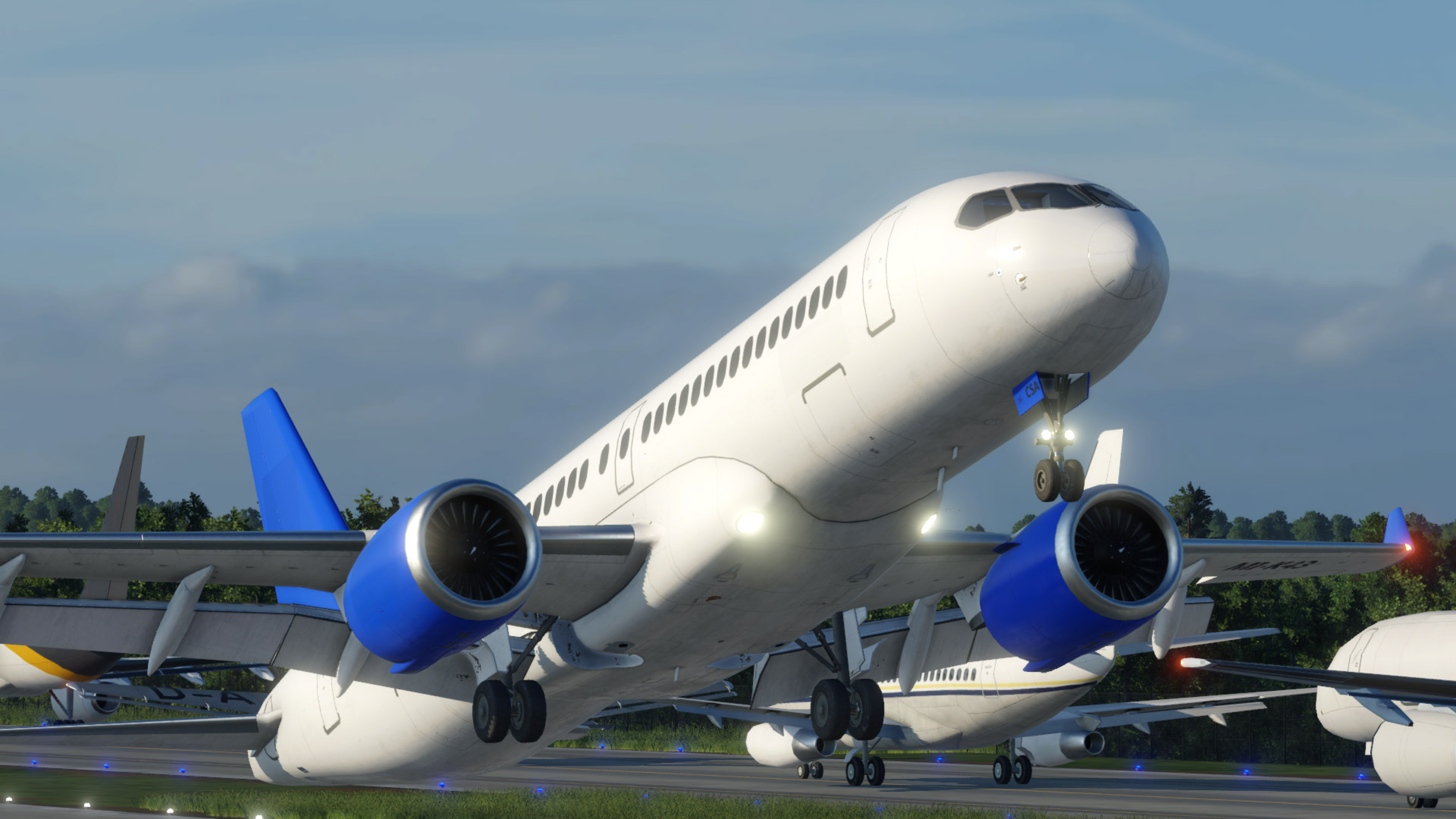 Ein Flugzeug startet. Das Flugzeug hat einen weißen Rumpf und blaue Akzente.
