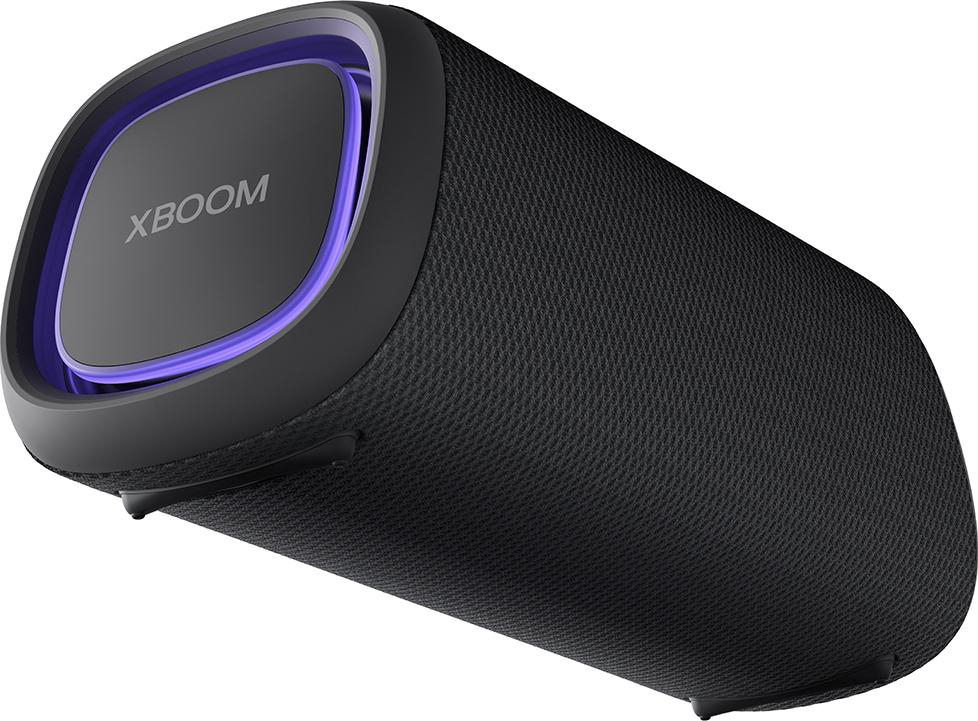 Ein schwarzer zylindrischer LG XBOOM-Lautsprecher mit einem lila Licht am oberen Rand.