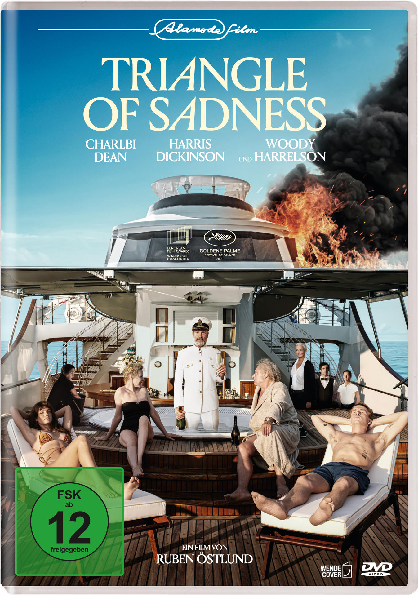 DVD-Cover. Eine Luxusyacht mit Feuer auf dem Oberdeck. Menschen entspannen sich auf dem Unterdeck.