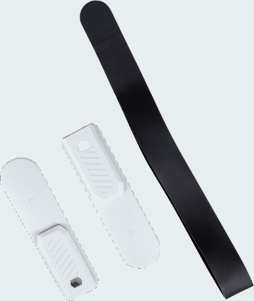 Three white and black objects on a white surface.