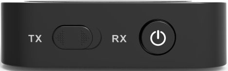 Appareil émetteur/récepteur audio noir. Possède TX, RX et un bouton d'alimentation. Fond blanc.