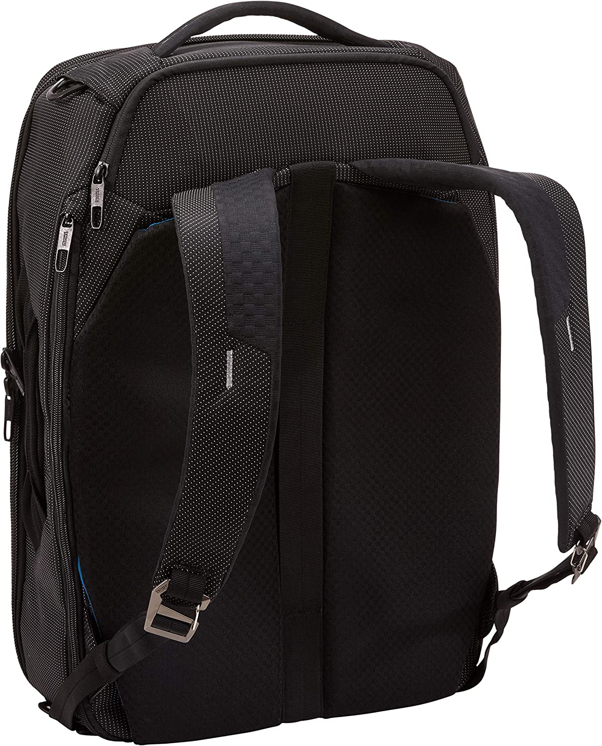 Mochila negra con lunares blancos y correas negras. La mochila tiene forma curva.