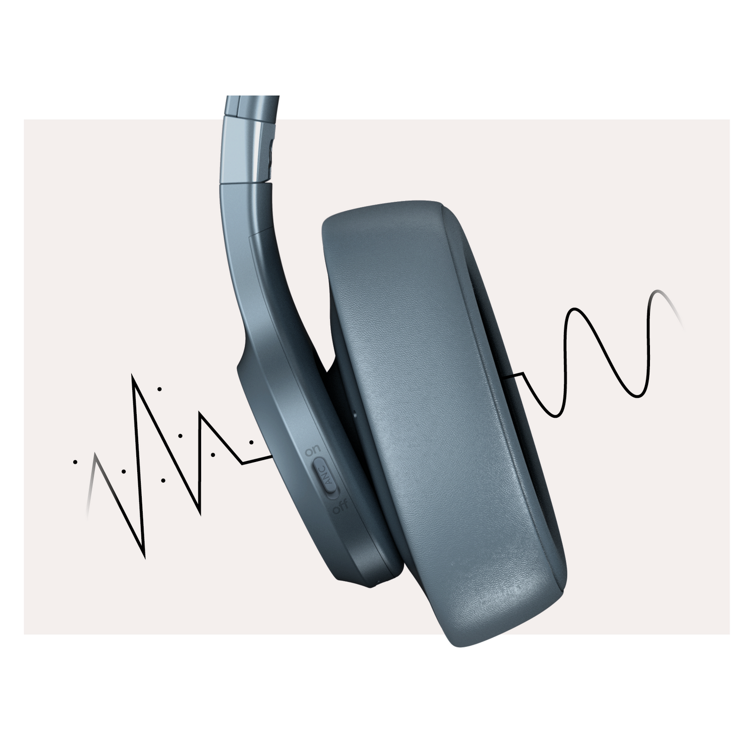 Gray headphones with a black line representing sound waves on a light beige background.