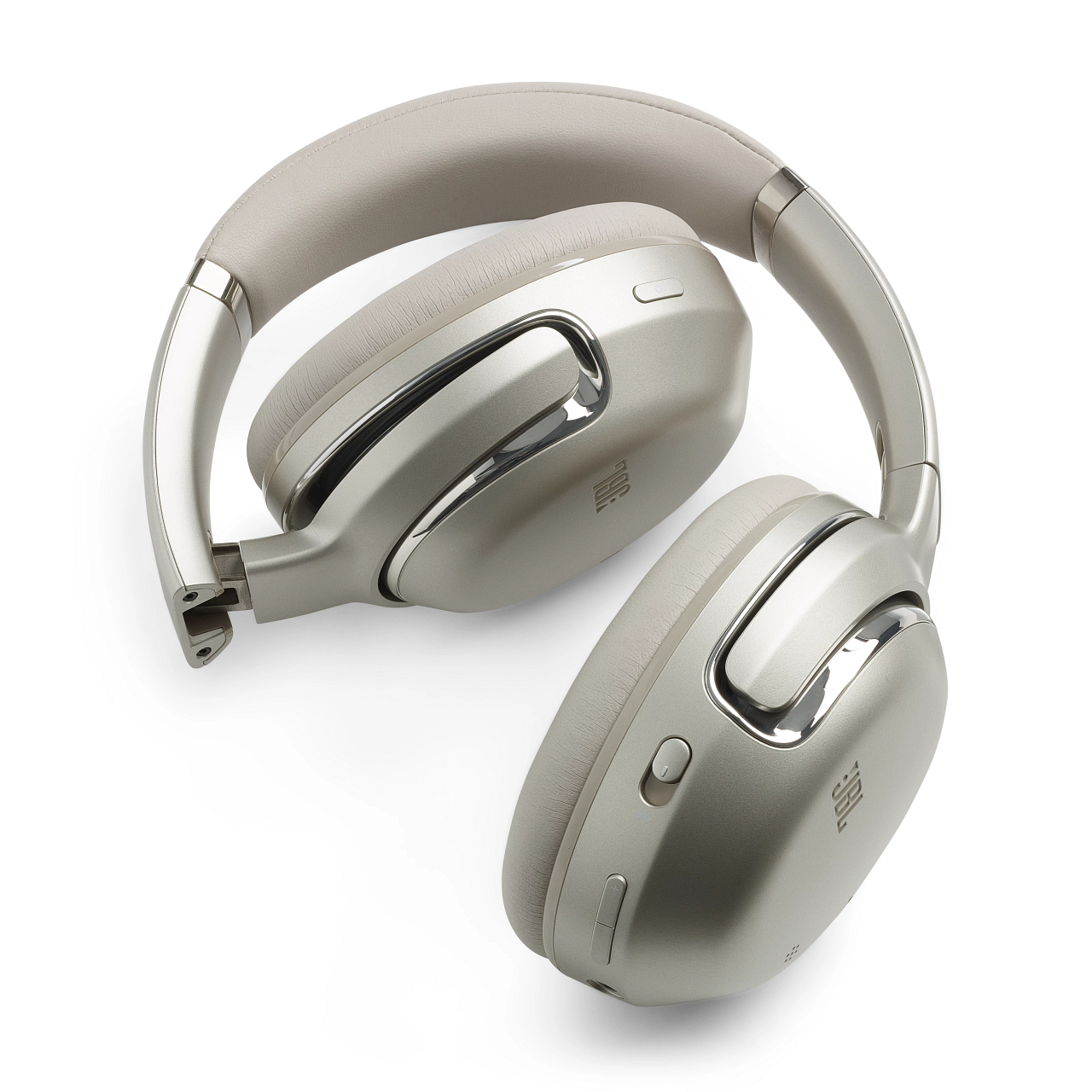 Graue JBL-Kopfhörer. Sie sind zusammengeklappt, die Ohrmuscheln zeigen nach oben.