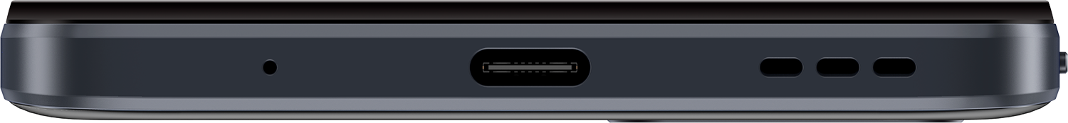 Close-up van de onderkant van een donkergrijs apparaat met USB-C-poort en gaten.
