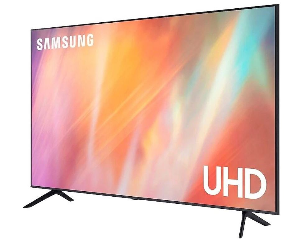 Büyük Samsung UHD TV. Renkli ekran. Siyah stand. Beyaz zemin.