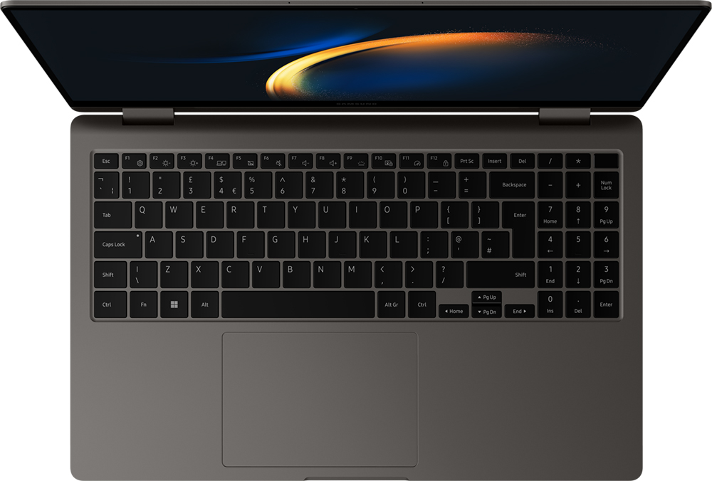 Een laptop met een open scherm, met een toetsenbord en touchpad, op een grijs oppervlak.