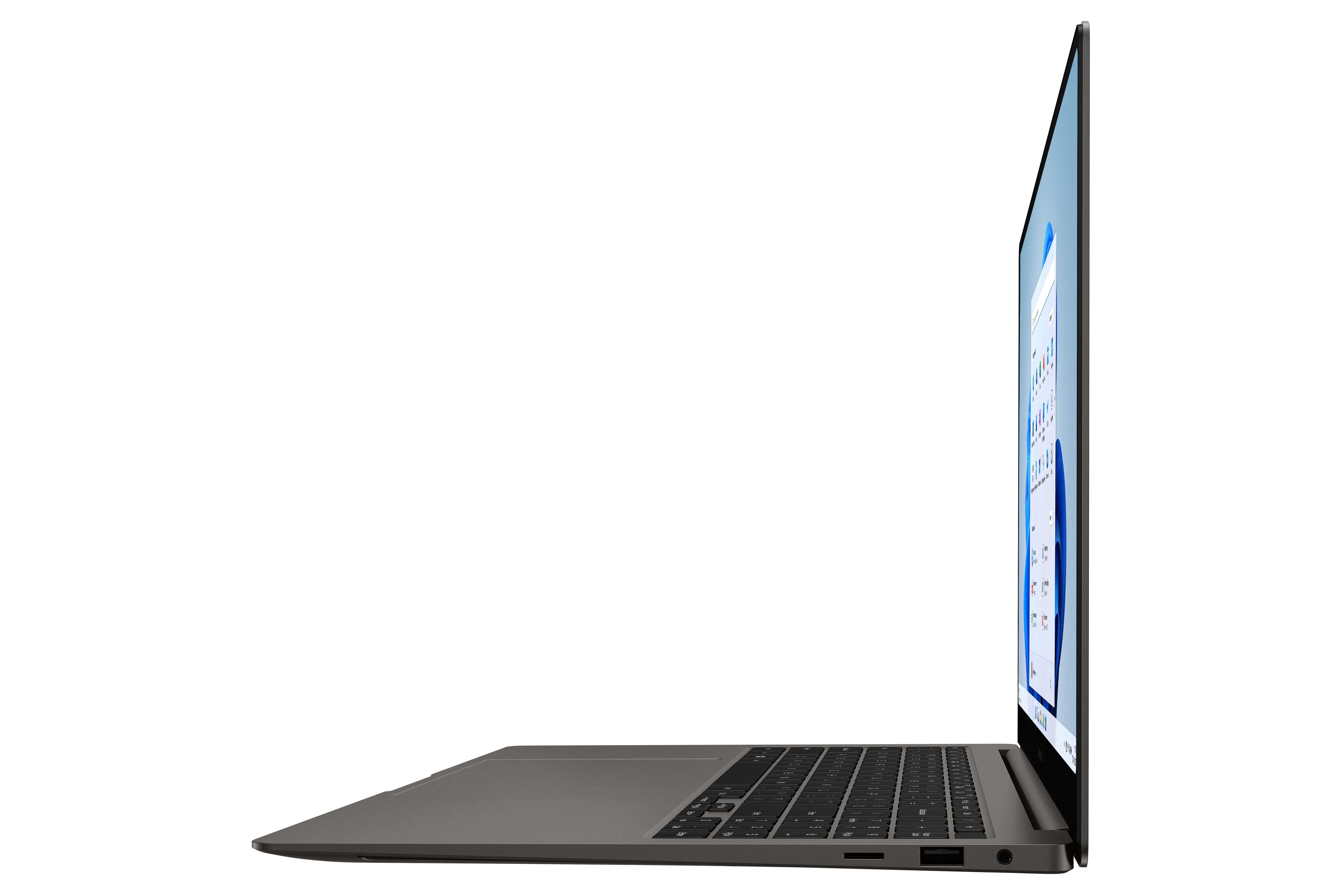 Laptop profile view, open. Screen shows a Windows interface. Keyboard is visible. Black background.