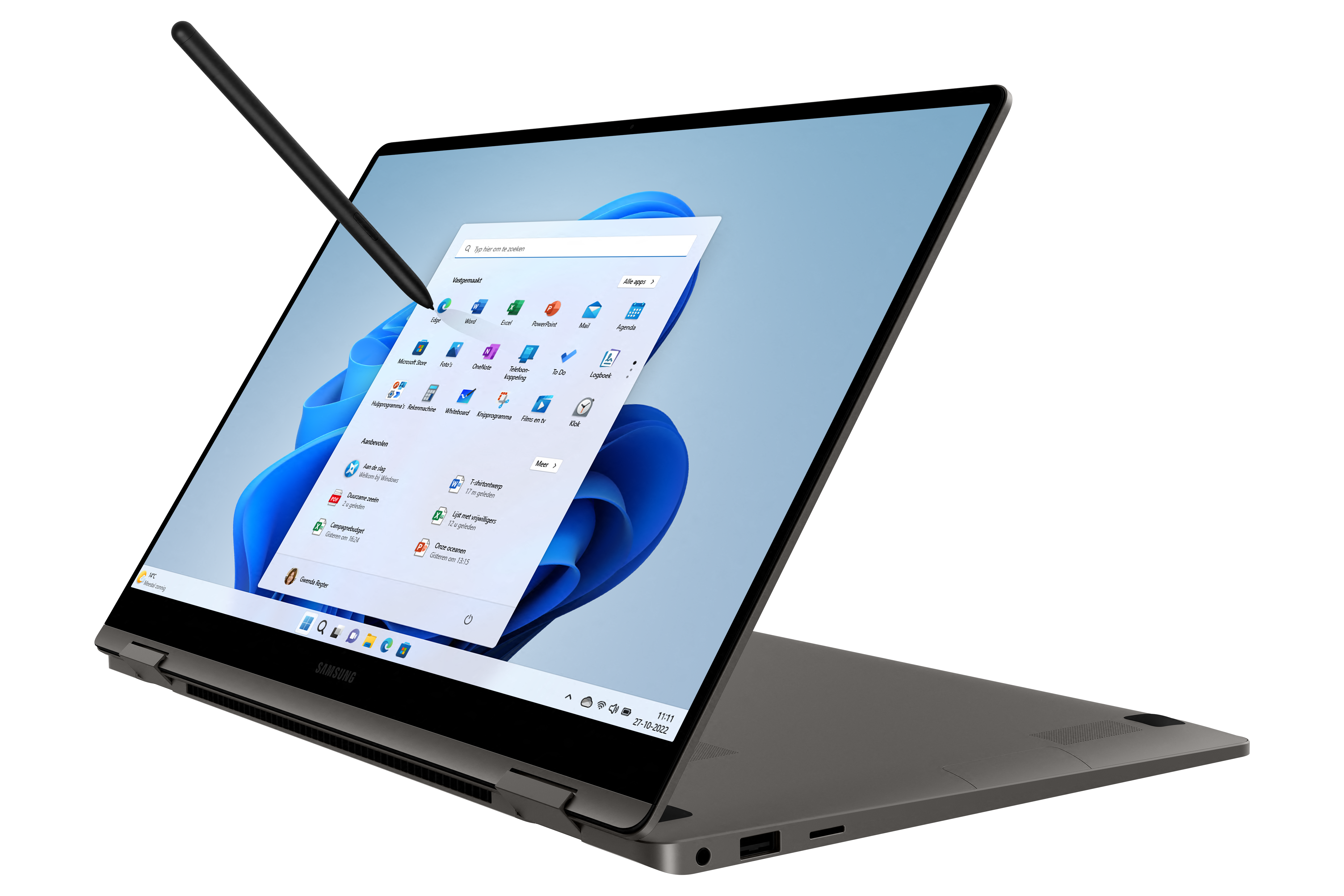 A dark laptop with a stylus pointing at the screen showing Windows 11.