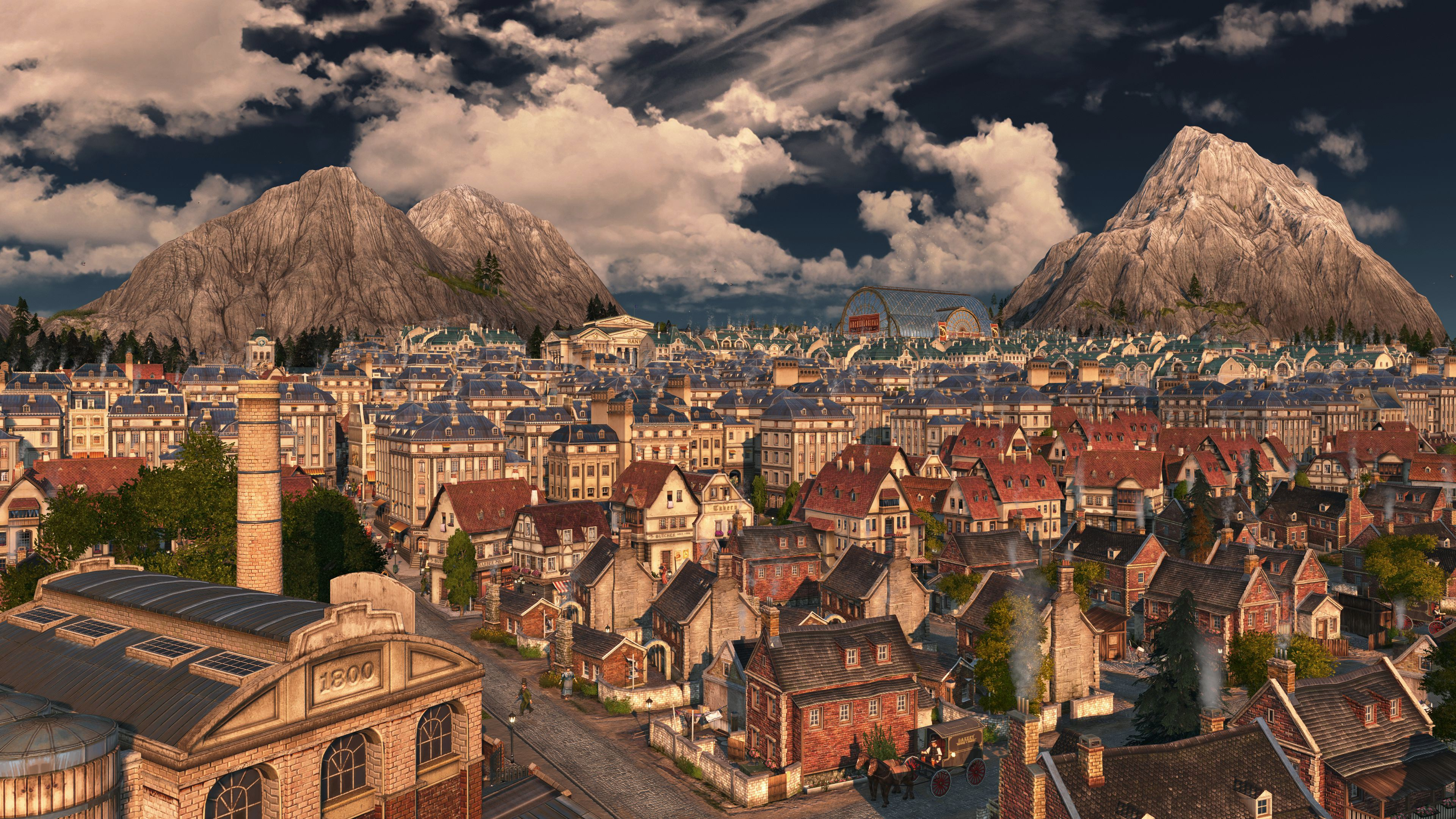 Paysage urbain avec bâtiments, montagnes et ciel nuageux.