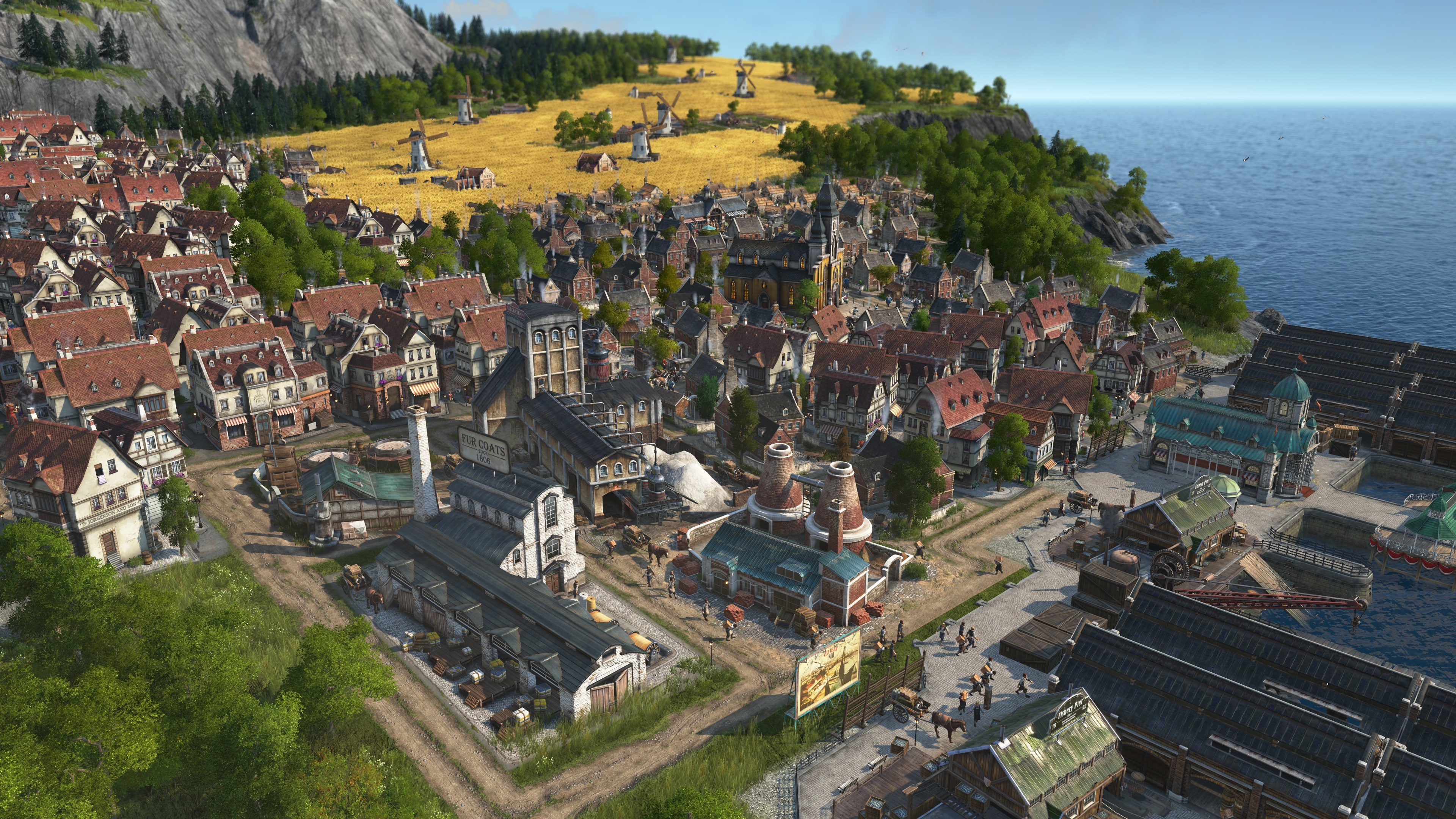 Une vue panoramique d'une ville avec des bâtiments, des arbres et un plan d'eau.