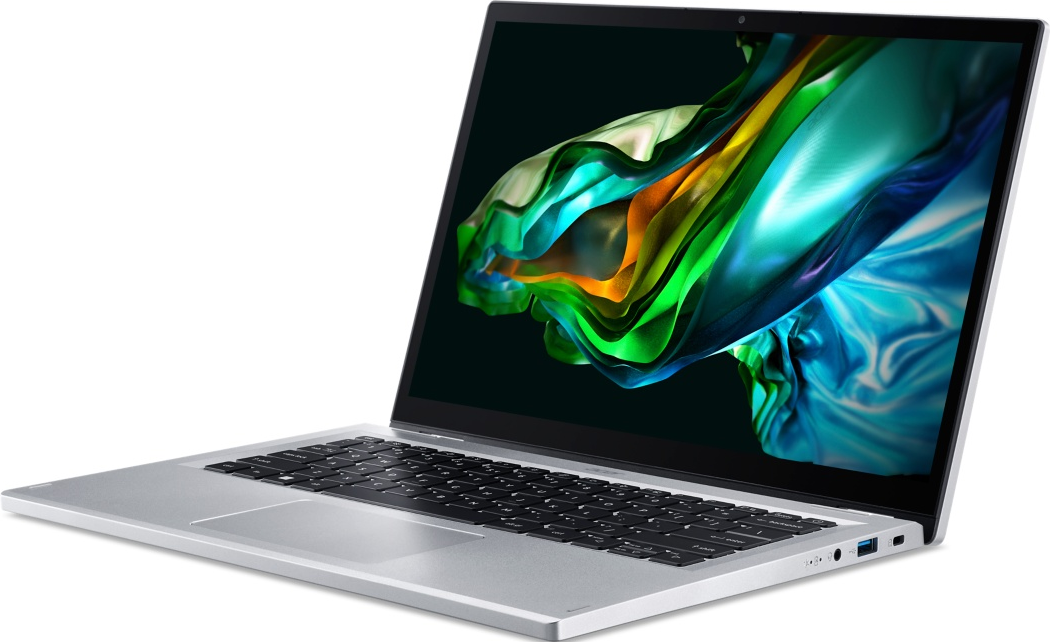 Laptop argentato su superficie bianca, schermo mostra motivo astratto colorato.
