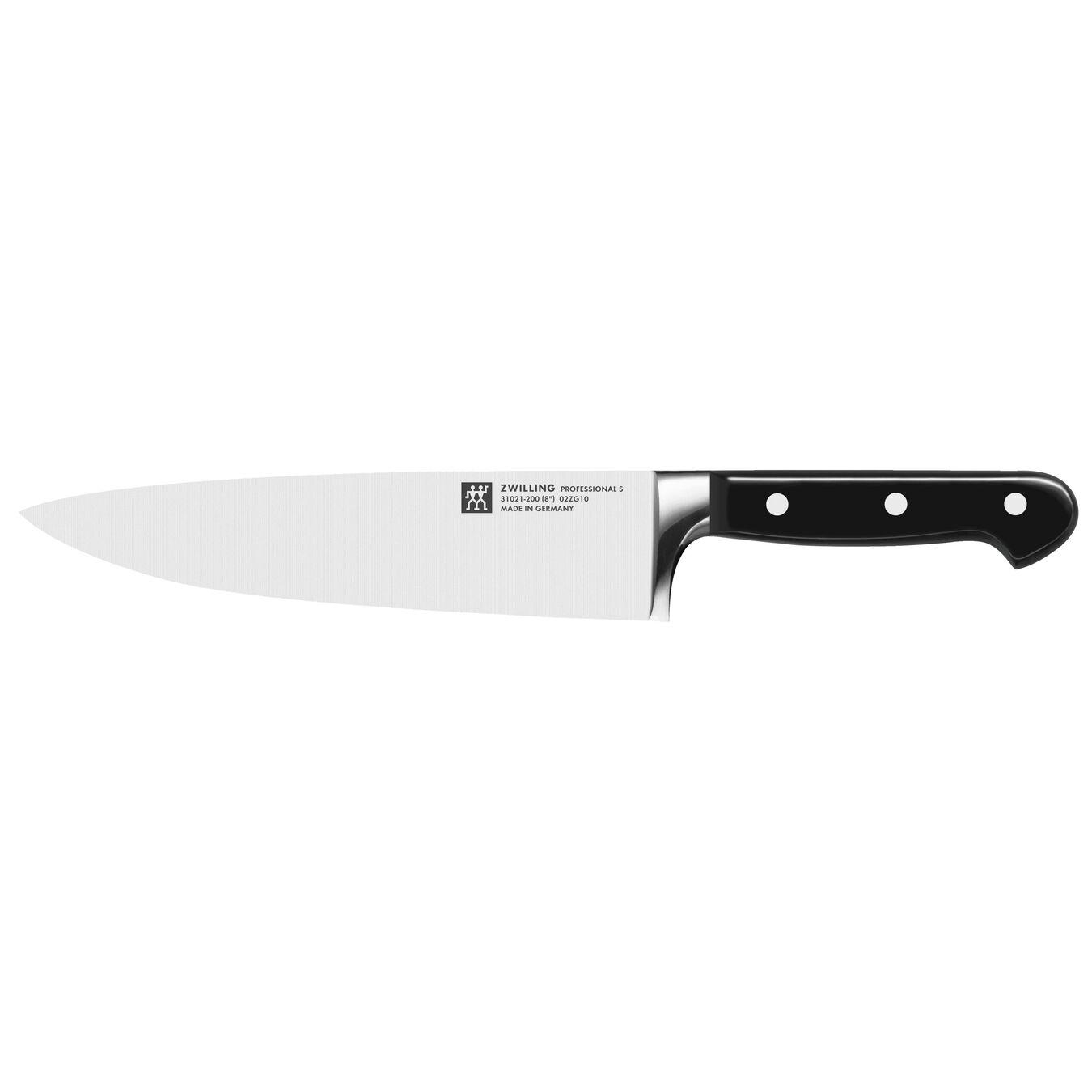 Ein Küchenmesser, schwarzer Griff, Klinge zeigt nach links. Weißer Hintergrund.