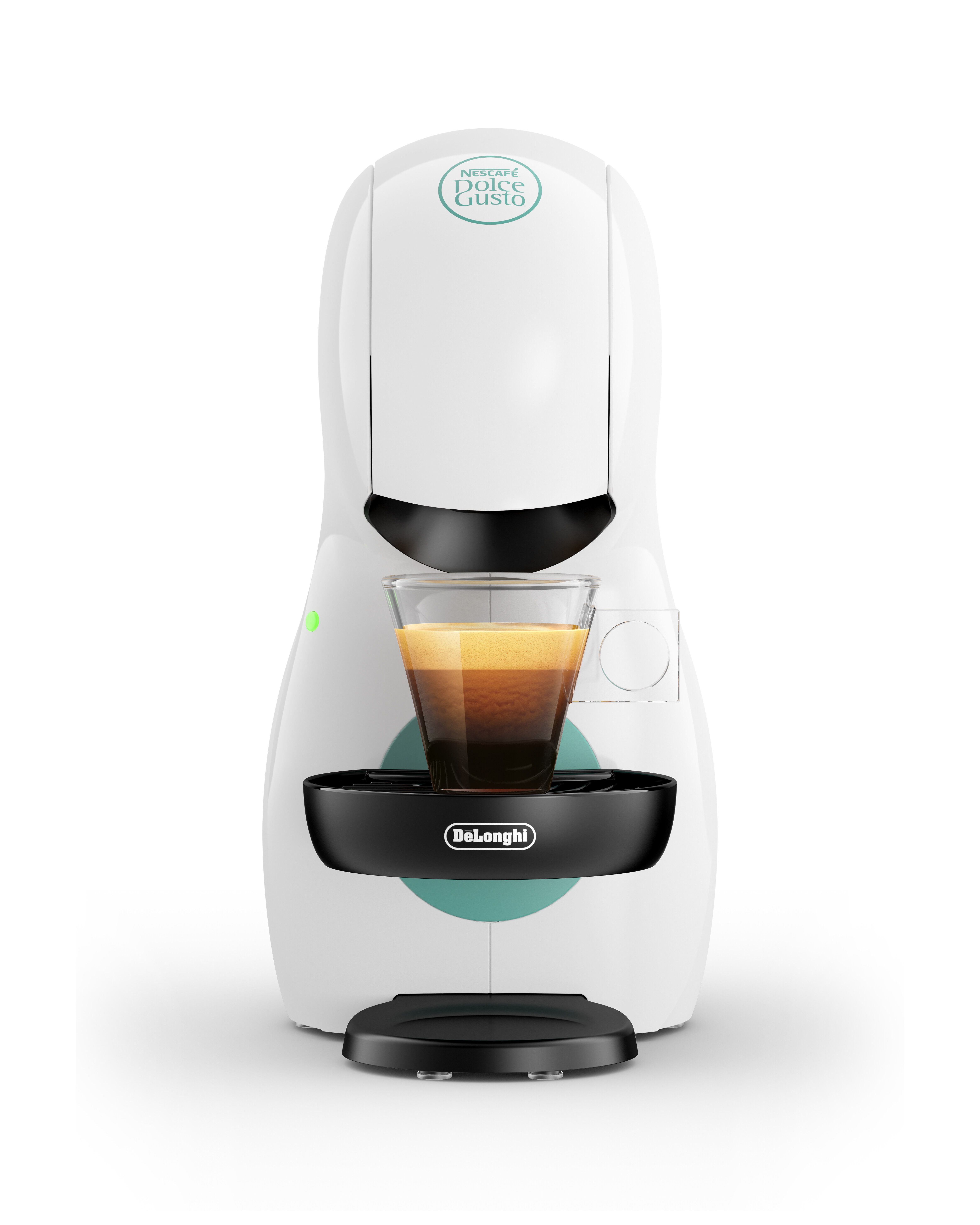 Máquina de café Dolce Gusto blanca. Una taza de cristal con café en la bandeja.