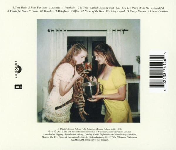 Zwei Frauen mit Katze und Getränk, Albumcover mit Titeln und Text drumherum.
