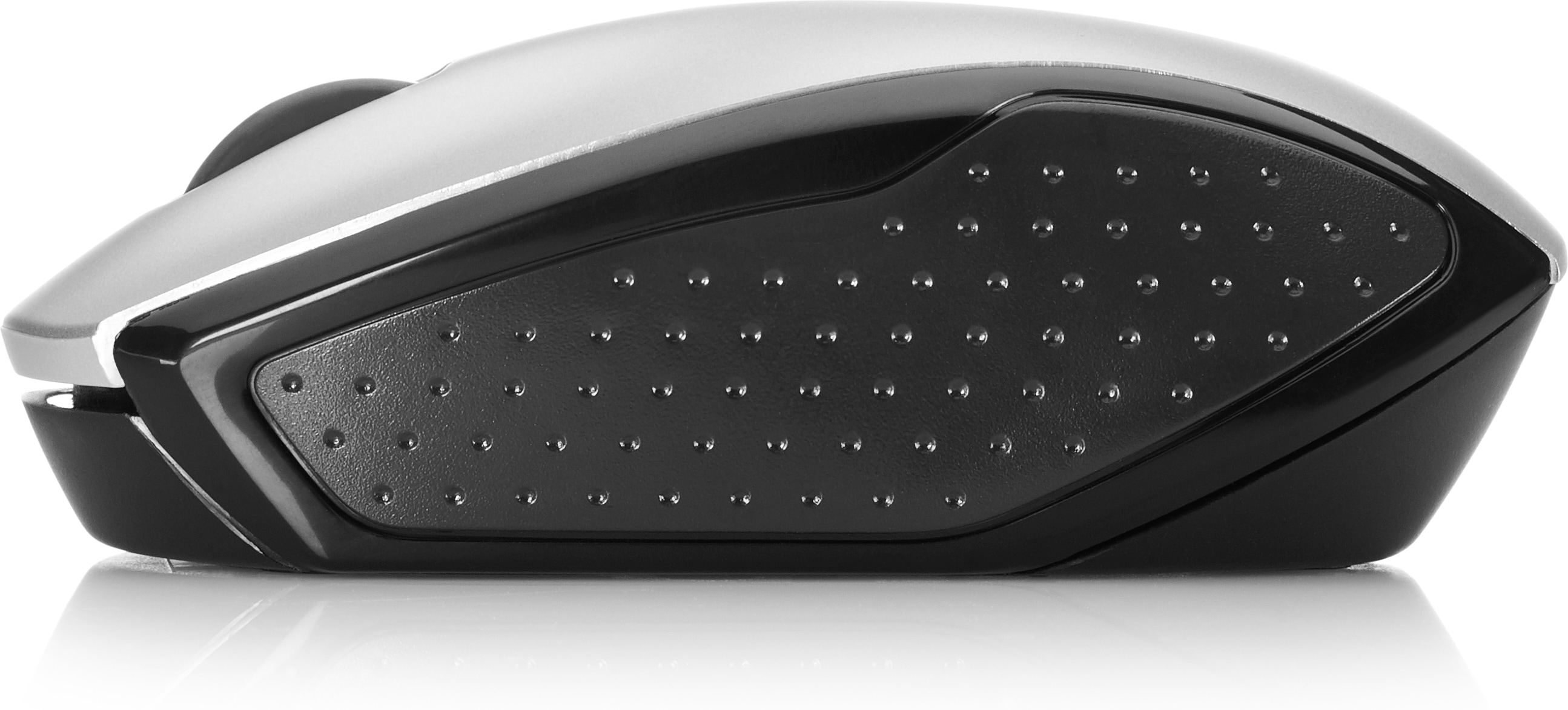 A silver and black computer mouse, viewed from the side. The black section has a textured surface with numerous small bumps.