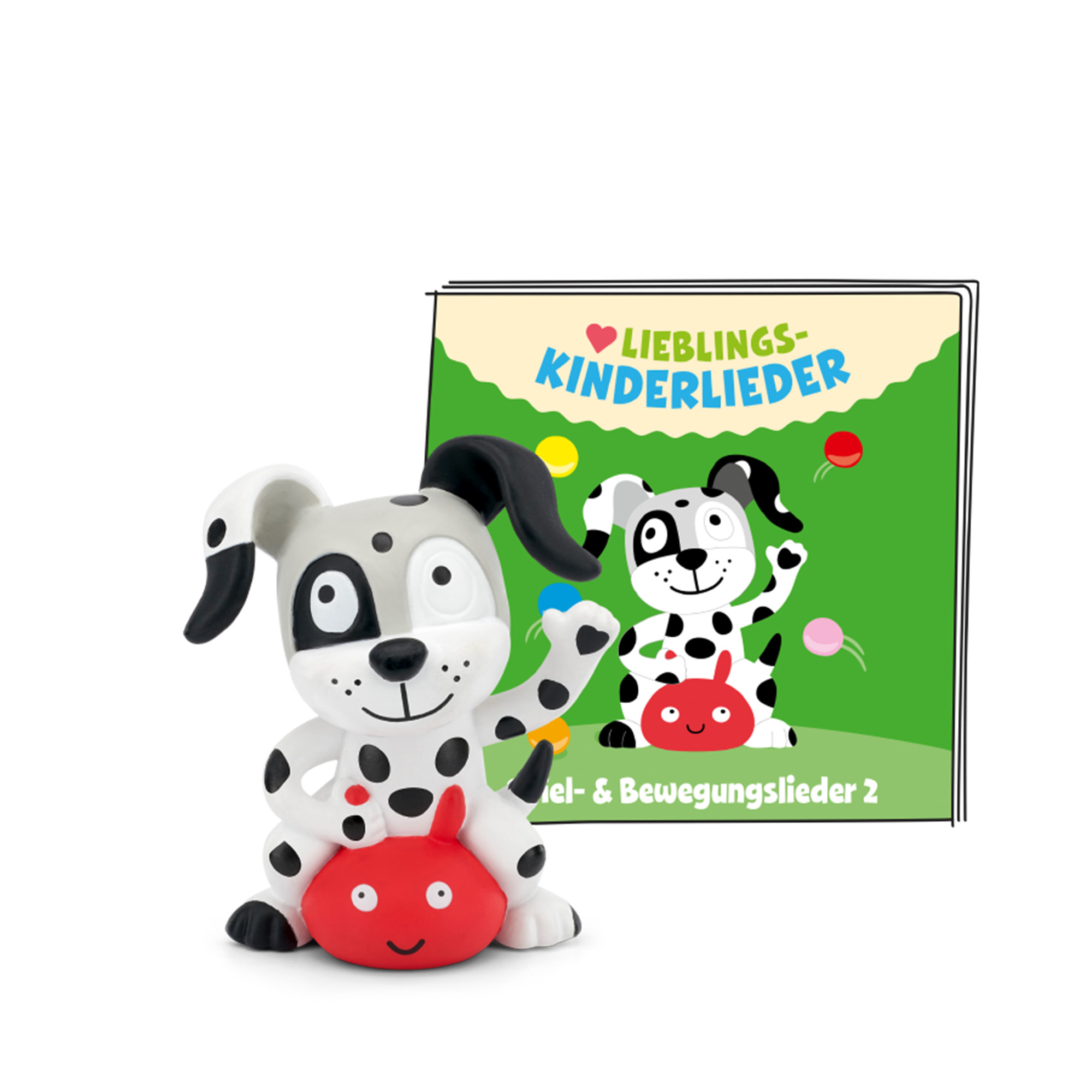 Dalmatiner-Figur mit rotem Gegenstand und Kinderbuch im Hintergrund.