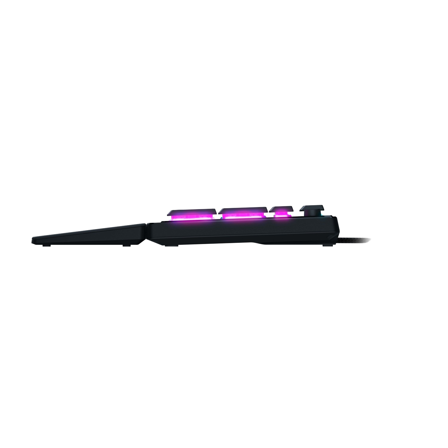 Black keyboard with illuminated keys; side view, on a black surface.