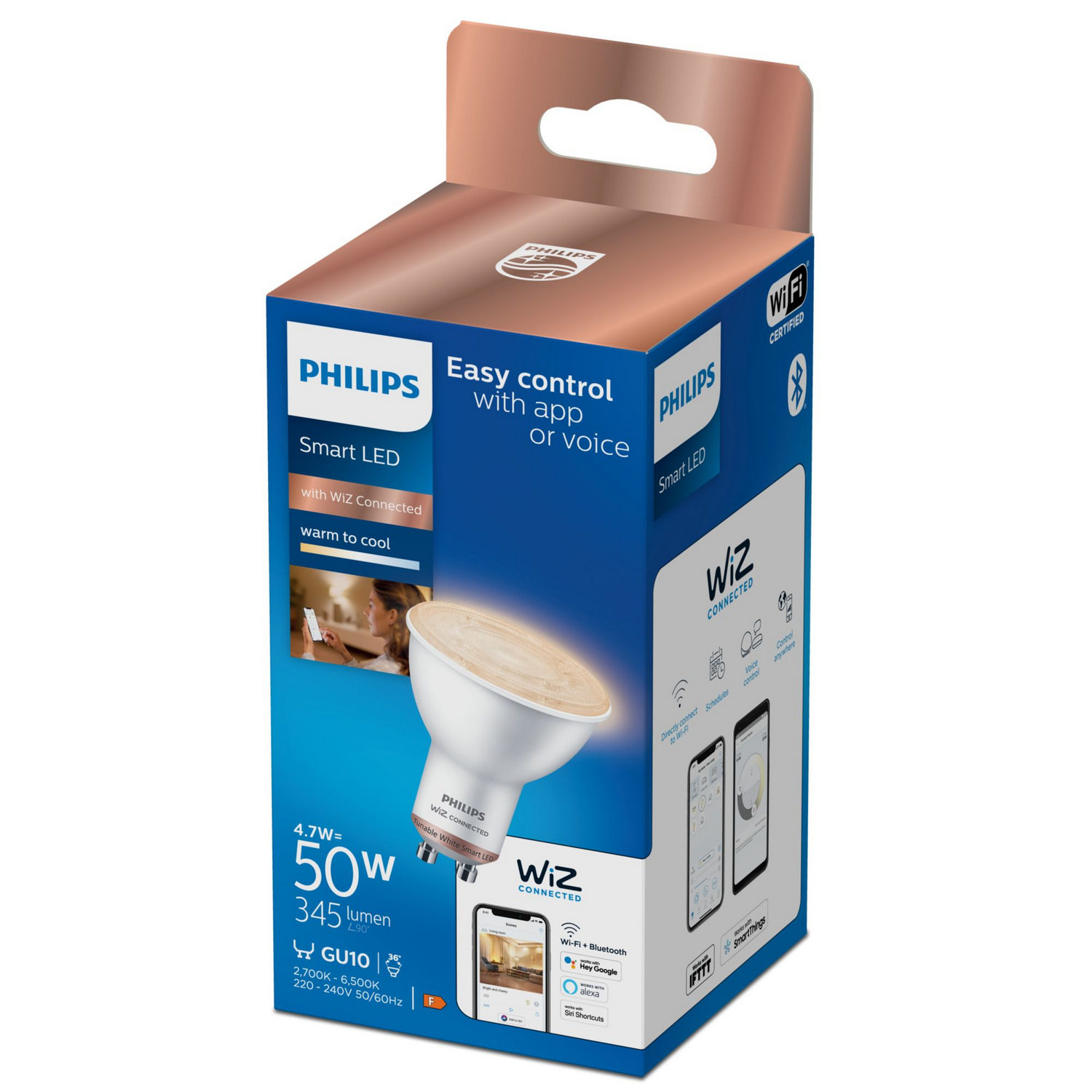 Una bombilla LED inteligente Philips en una caja, que promociona 'Control fácil con app o voz'.
