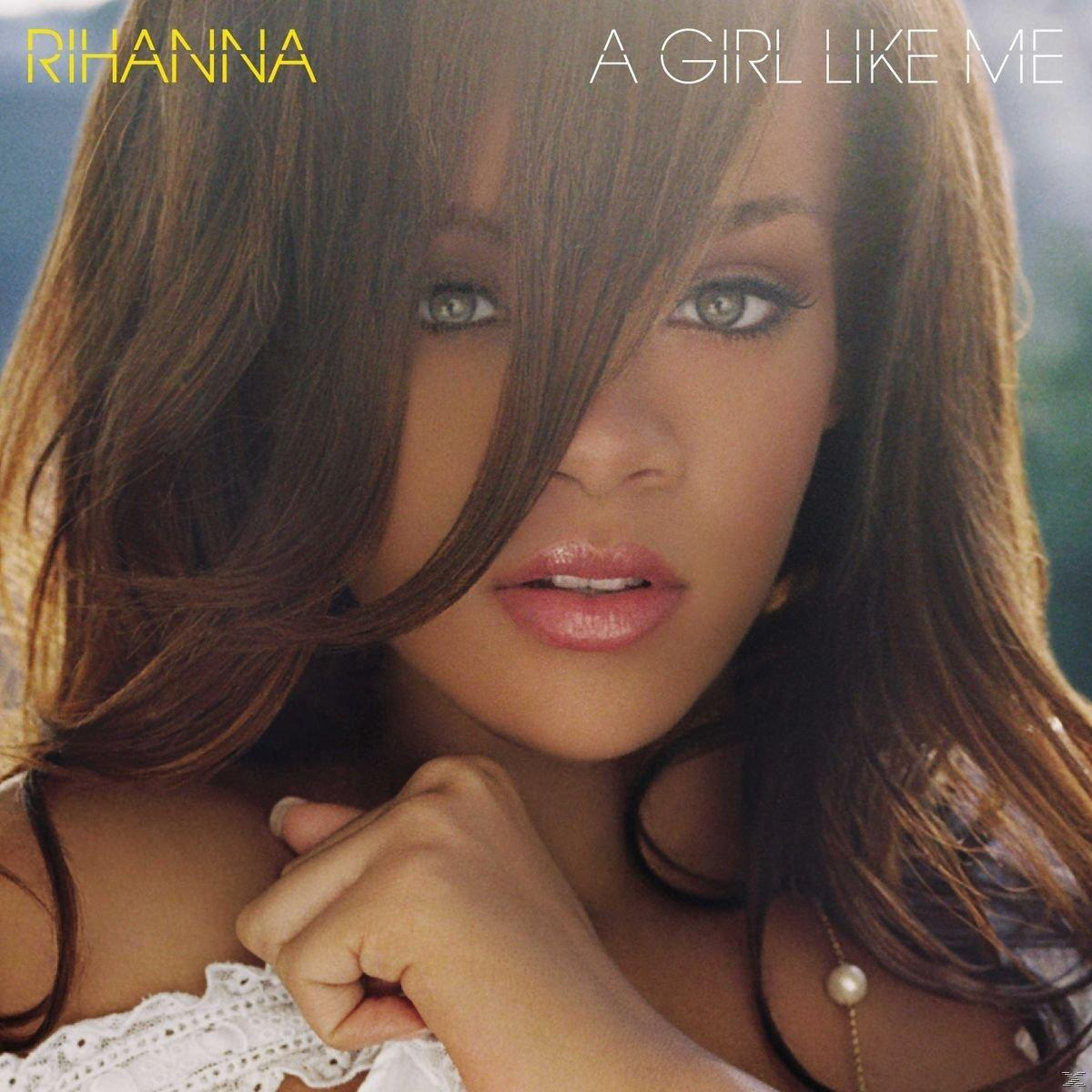 Rihanna album borító, közeli kép az arcáról, hosszú barna haj, gyöngy nyaklánc.