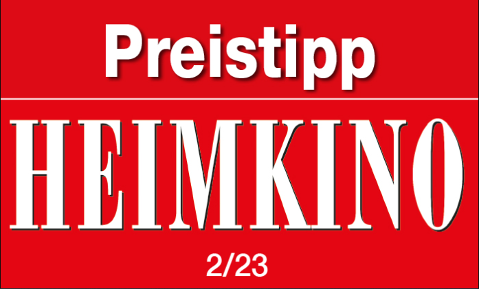 Rotes Schild mit weißem Text: 'Preistipp HEIMKINO' und Datum 2/23.