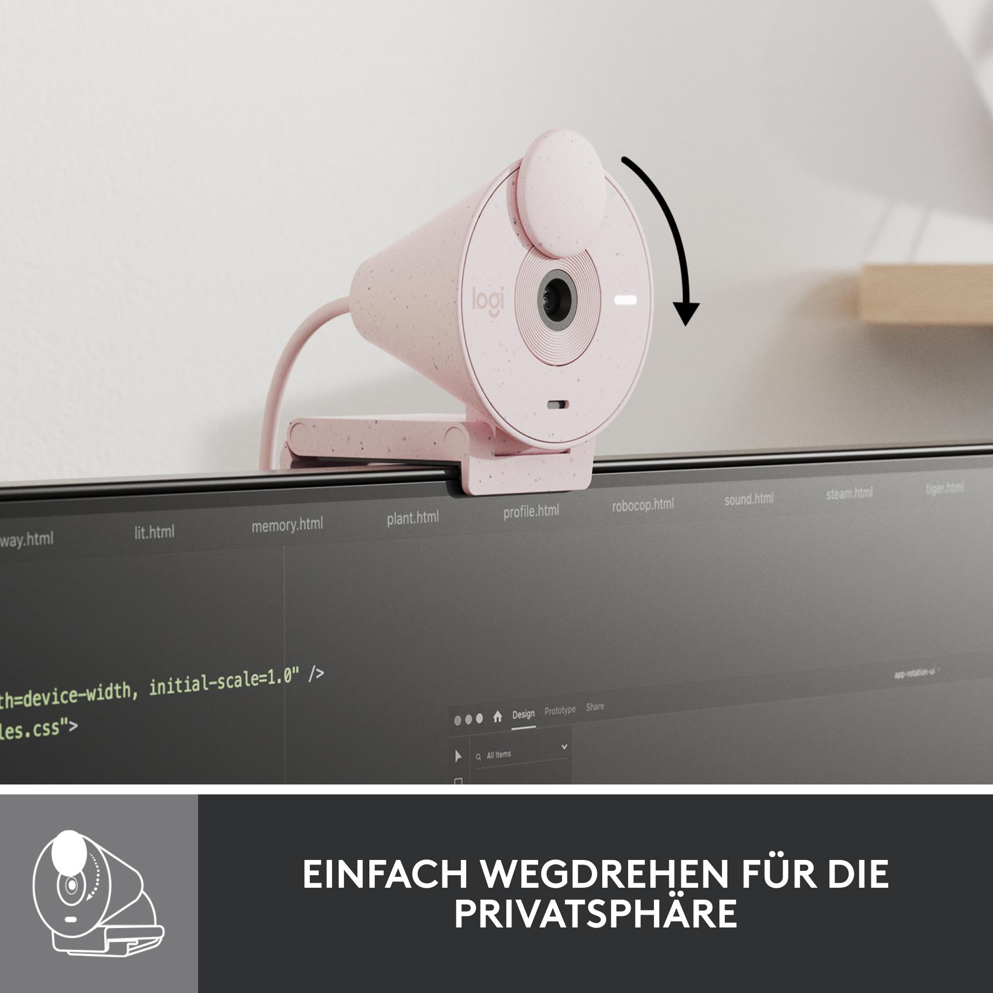 Eine pinke Webcam auf einem Monitor montiert. Das Objektiv kann für Privatsphäre gedreht werden. Schwarzer Text darunter.