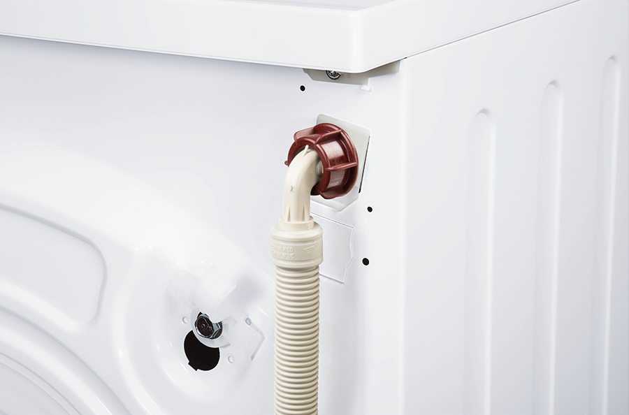 Back of a white washing machine, showing a hose connection.
