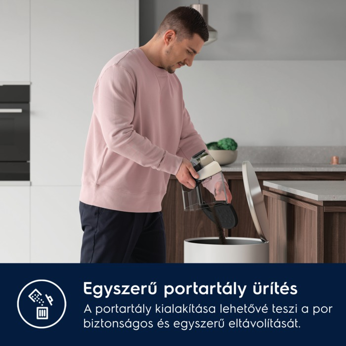 Férfi porszívó portartályát üríti egy szemetesbe.