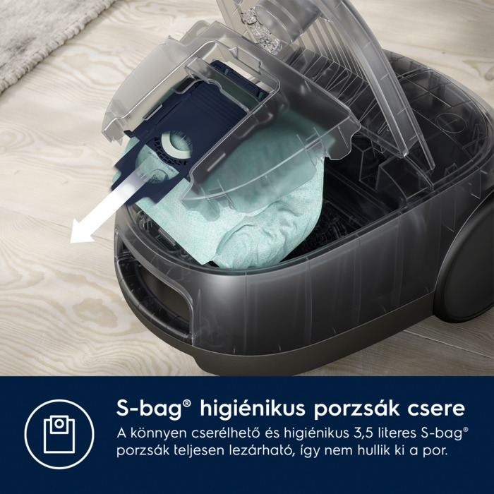 Porszívó a zacskó cseréjét mutatja. A szöveg elmagyarázza a folyamatot.
