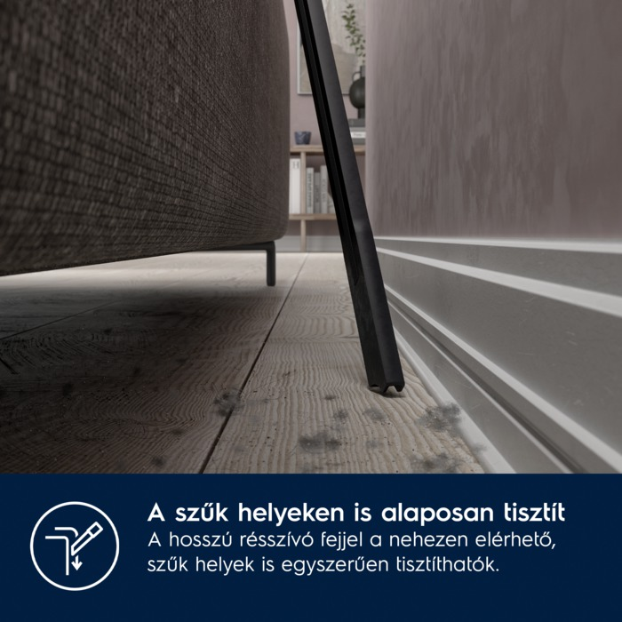 Közelkép egy porszívófejről, amely a padlót tisztítja a kanapé közelében. Szöveg: Szűk helyeken is tisztít.