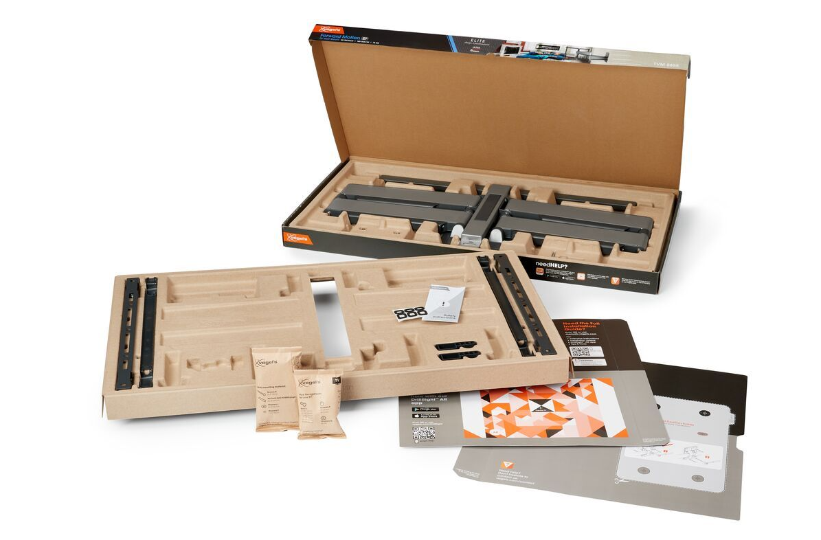 Kit di montaggio a parete con confezione, istruzioni e componenti, aperto su sfondo bianco.