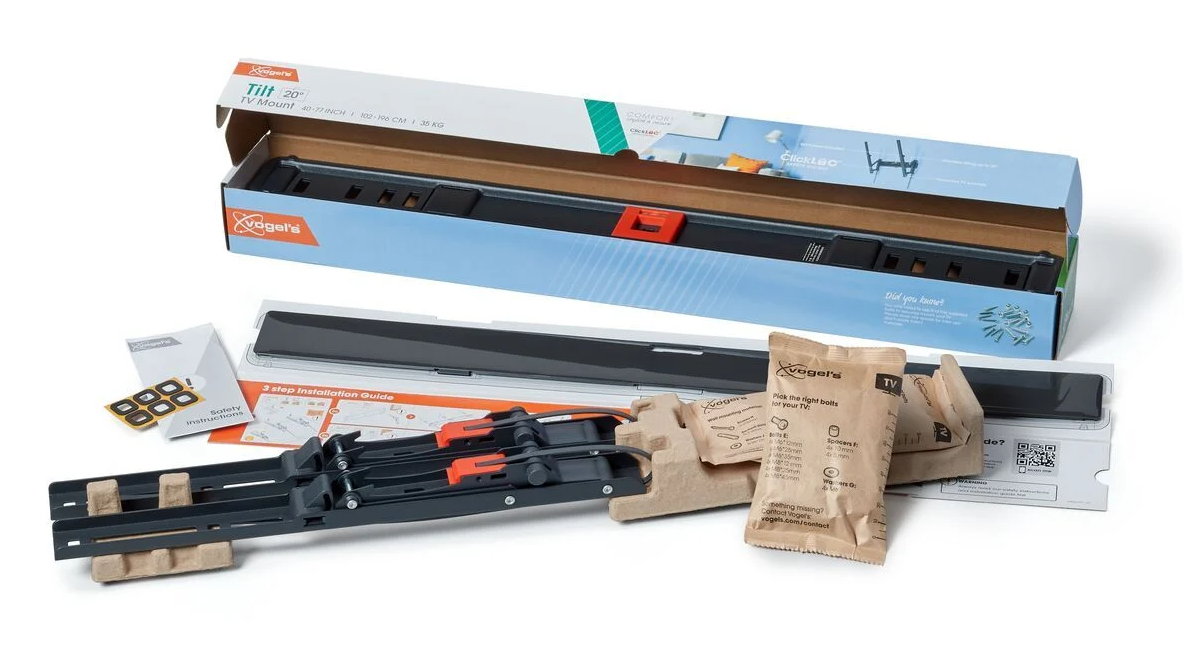 Kit de fixation TV avec divers composants déballés.