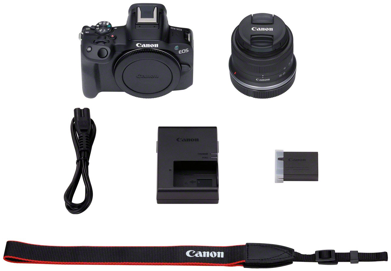 Canon EOS Kamera-Kit: Kamera, Objektiv, Ladegerät, Akku, Gurt, alles schwarz, auf weißem Grund.