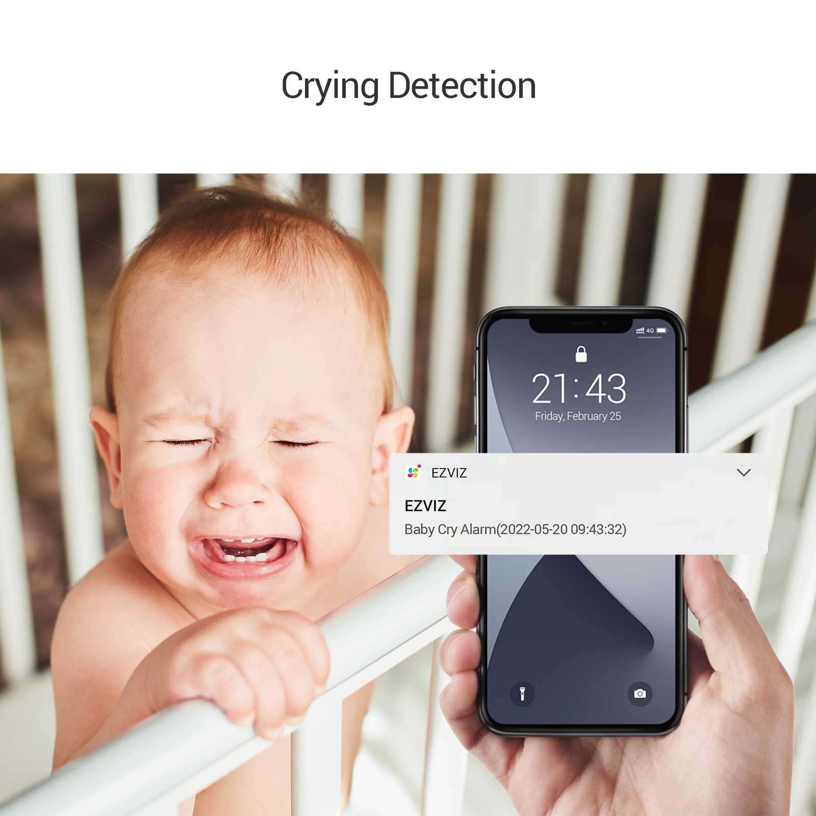 Ein Baby weint in einem Kinderbett, ein Telefon zeigt eine 'Baby-Weinen-Alarm'-Benachrichtigung.