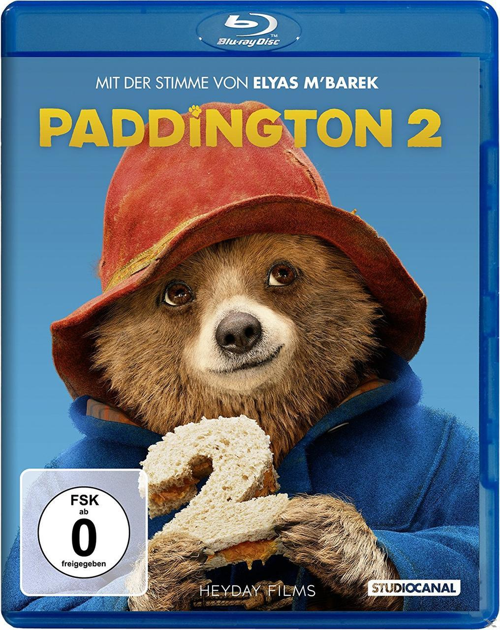 Paddington 2 Filmcover. Bär hält Sandwich. Blauer Hintergrund. Blu-ray Logo. FSK 0.