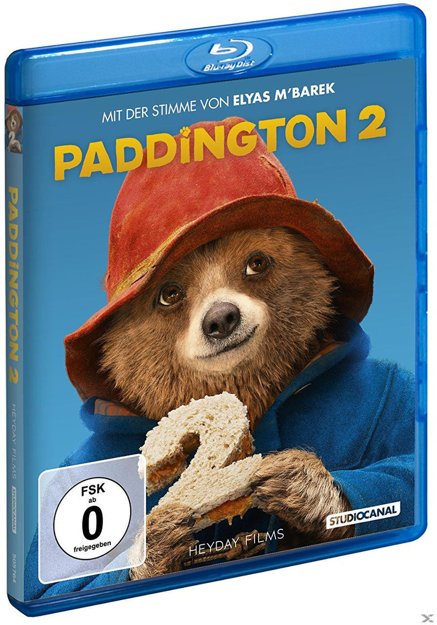 Paddington 2 Blu-ray-Hülle mit dem Bären auf dem Cover, einem Sandwich im Mund.
