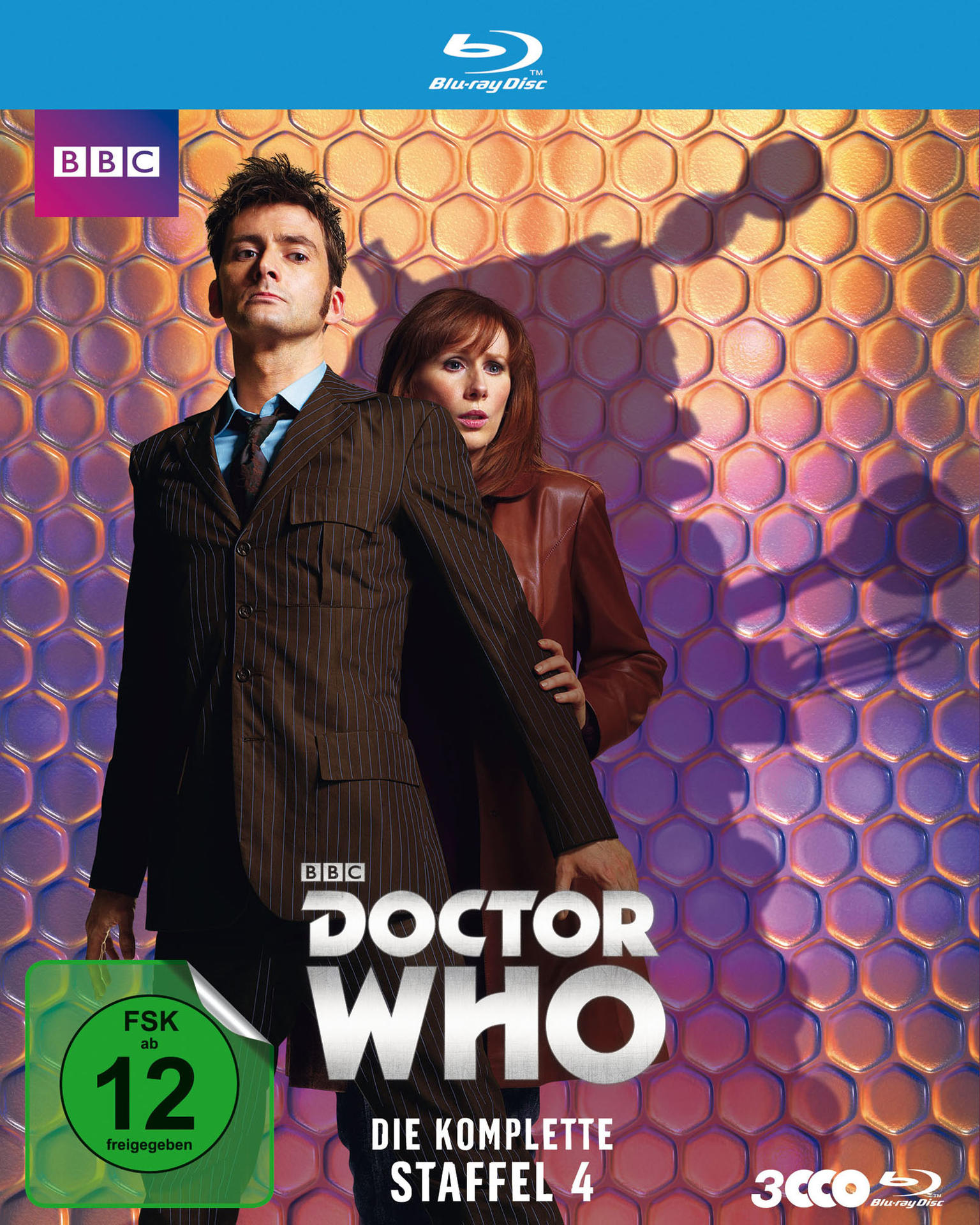 Doctor Who DVD Cover. Der Doktor und Donna stehen vor einer Bienenwabenwand.