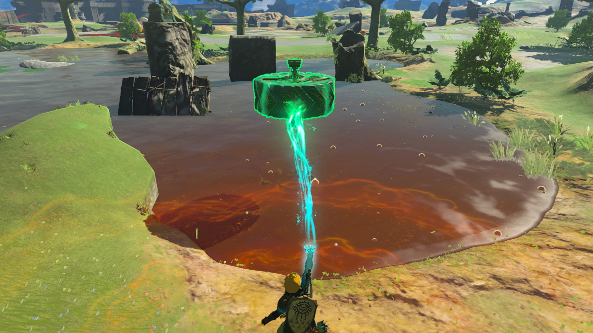 Eine grün leuchtende Energiesäule erhebt sich aus einem Teich in einer Spielszene.