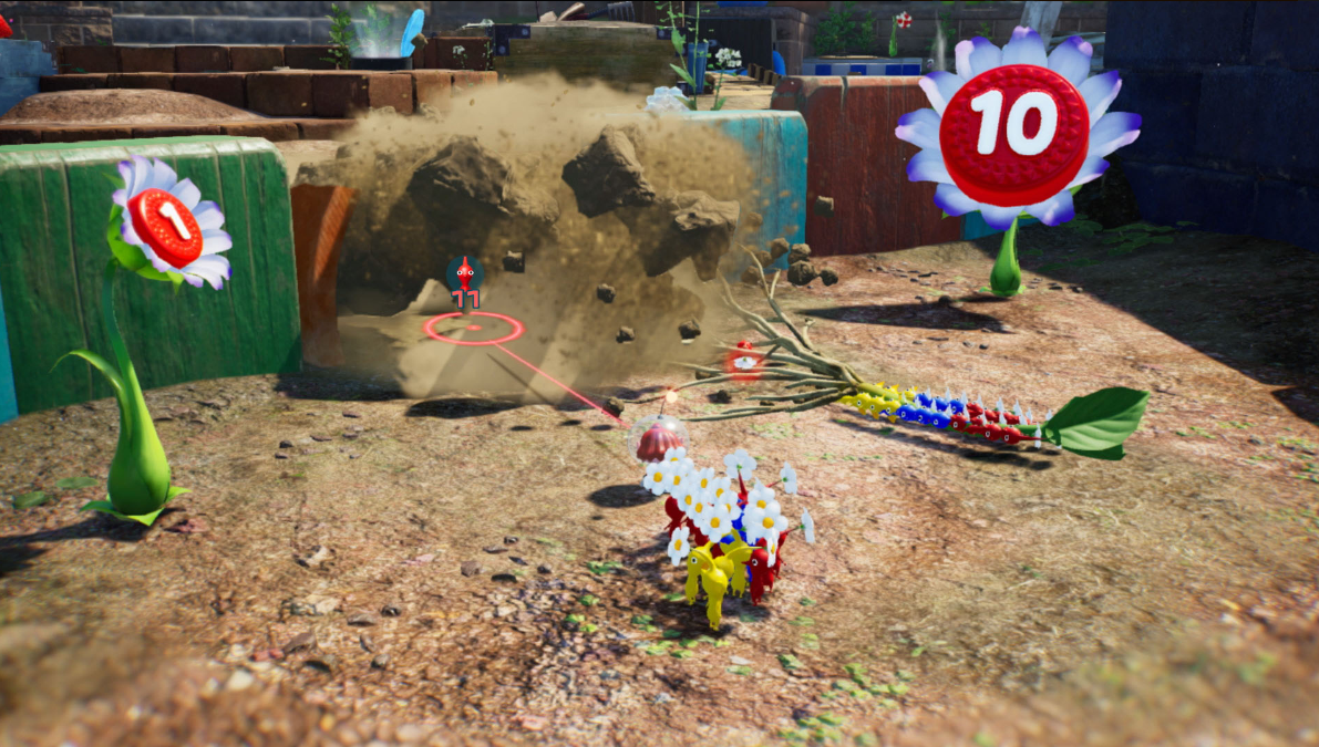 Eine Spielszene mit bunten Blumen, Kreaturen und einer Staubexplosion. Eine Blume mit der Zahl 10 sticht hervor.